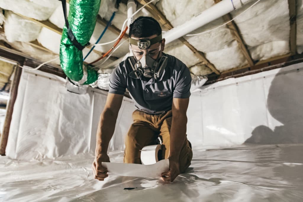 crawl space contractor installing encapsulation