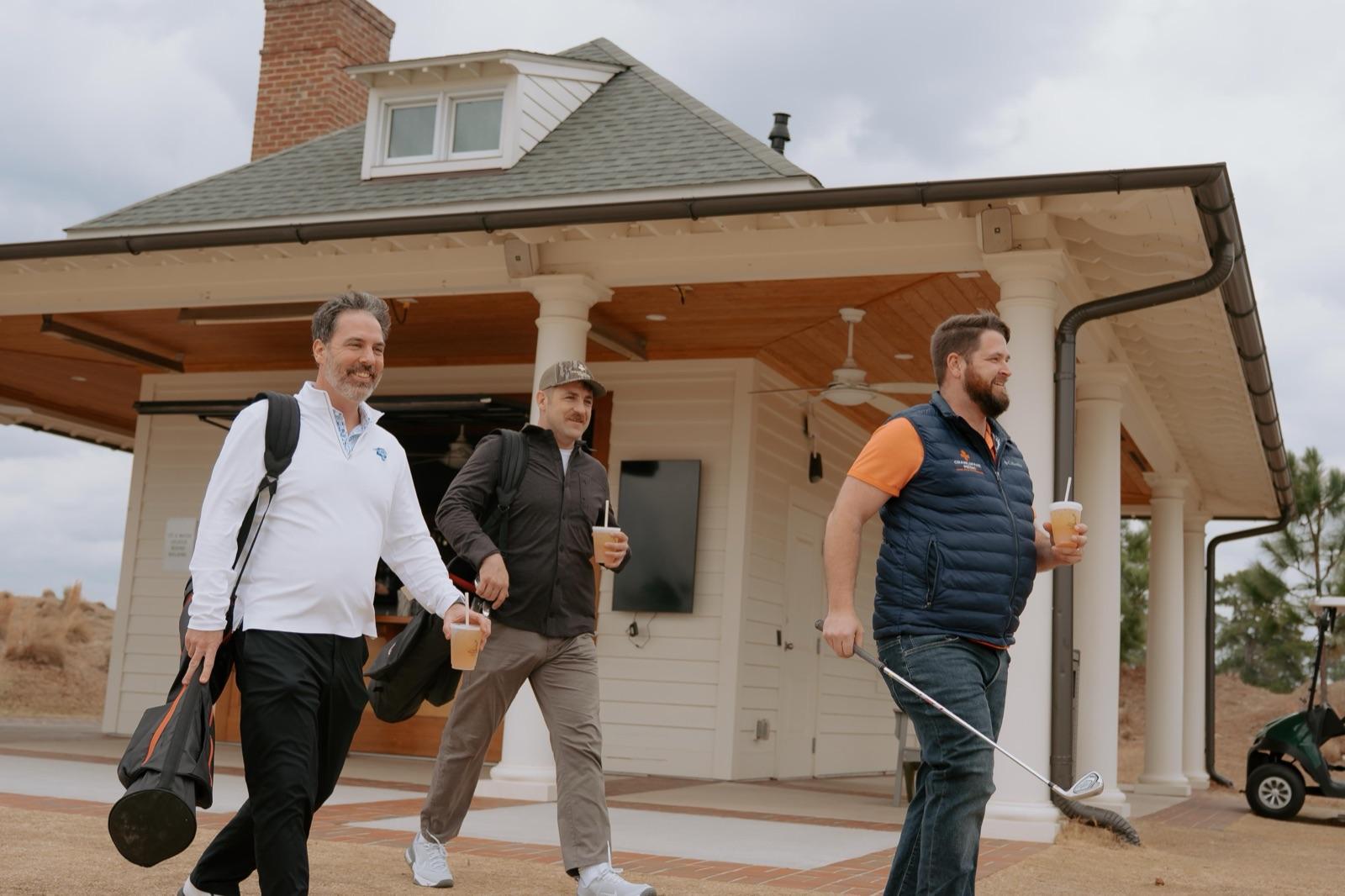 Team members walking the course at the annual Pinehurst golf retreat