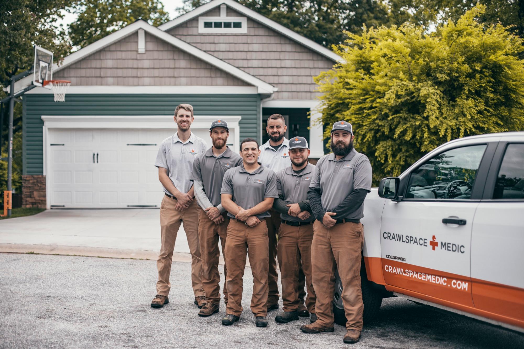 A Crawlspace Medic crew with their truck