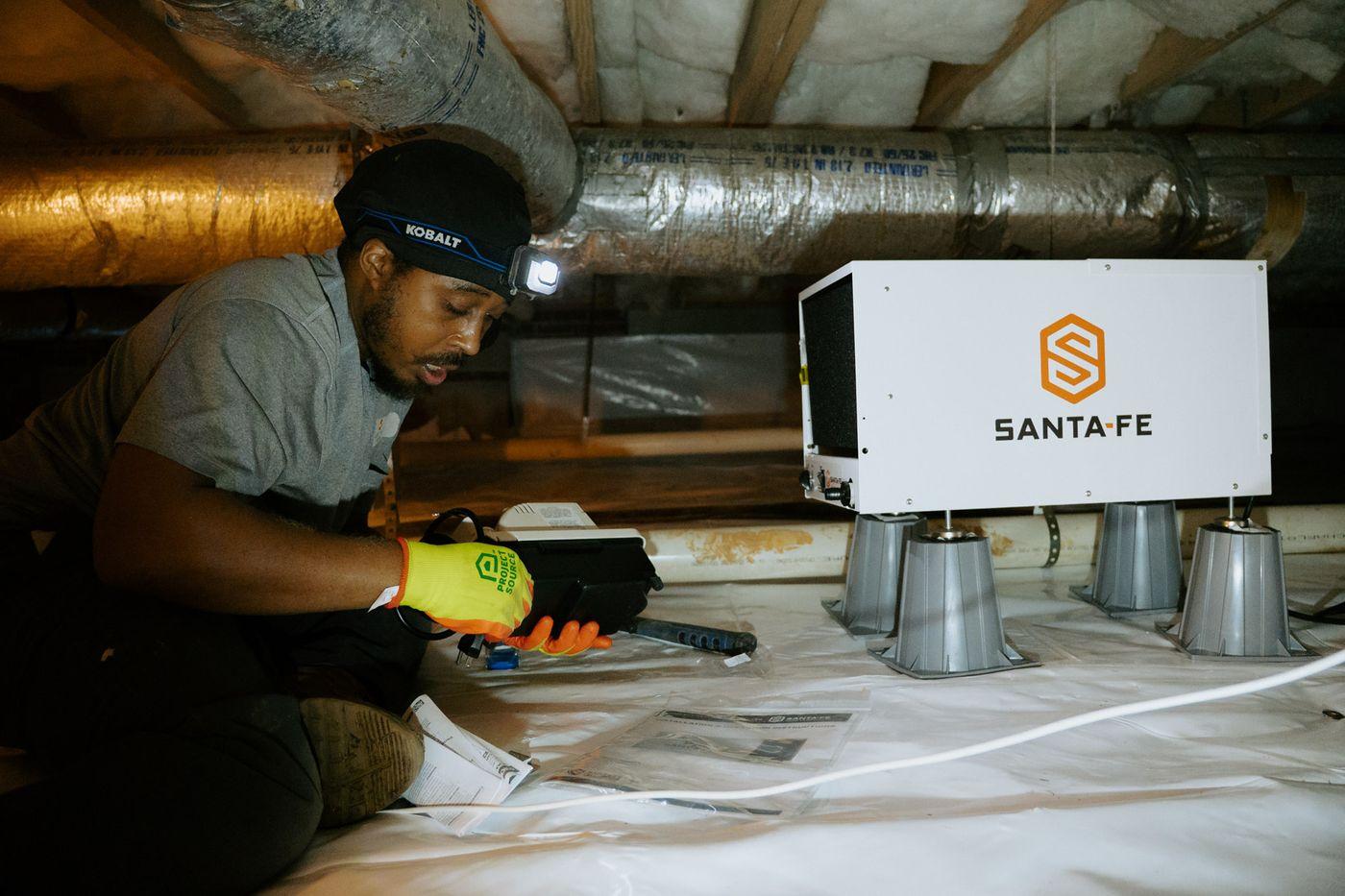Crawlspace Medic crews at work under a home.
