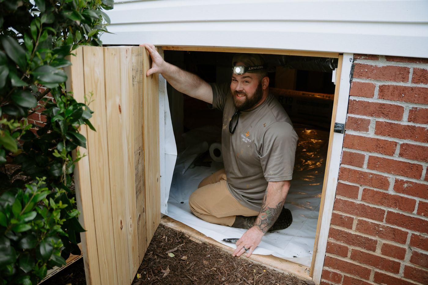 Crawlspace Medic crews at work under a home.