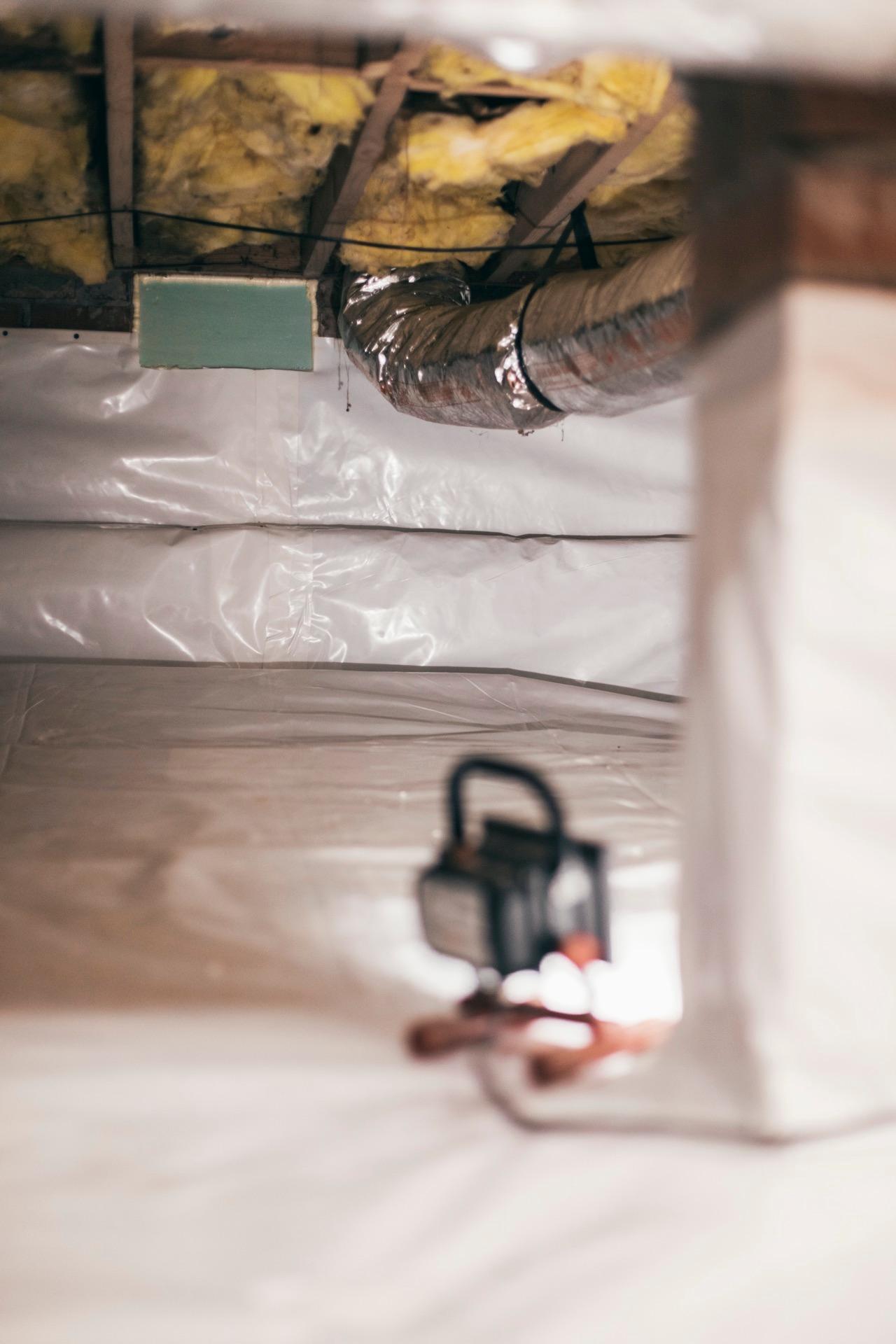 A finished, sealed crawl space with the vapor barrier installed
