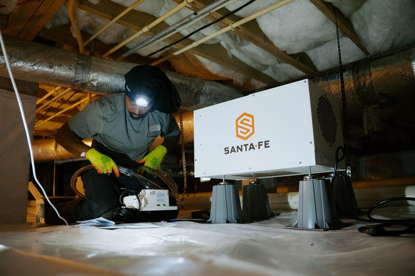 Crawlspace Medic crews at work under a home.