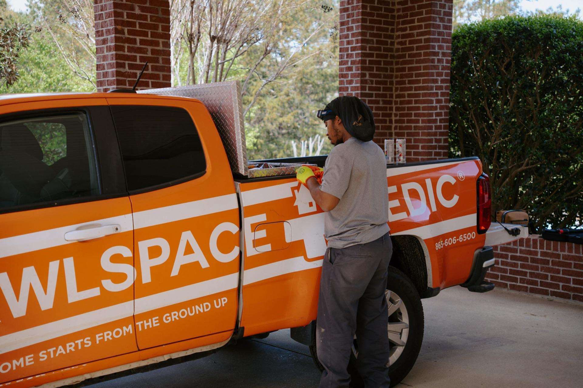 A Crawlspace Medic truck arriving at a customer's home